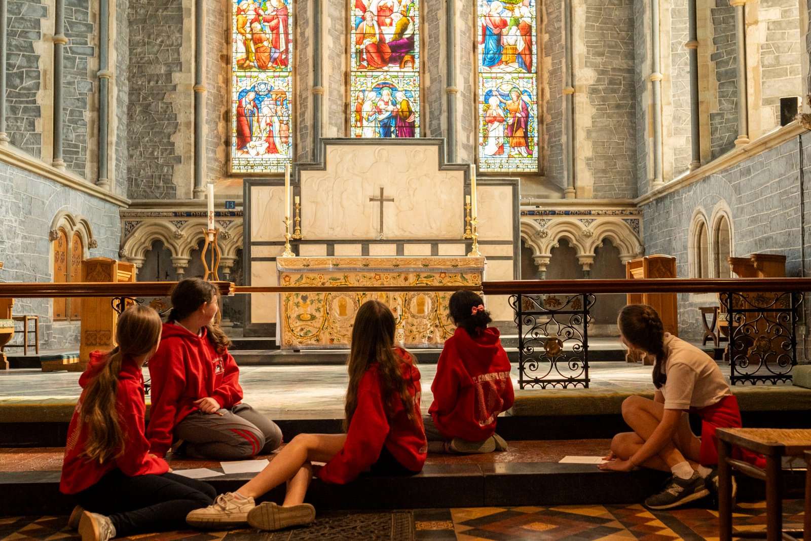 Children sitting on the alter in St Canice's Cathedral